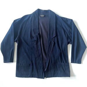 vintage dark blue denim jacket with pockets and a relaxed fit